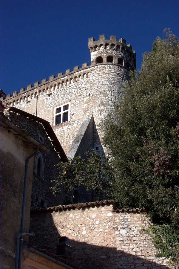 Tall stone tower against a deep blue sky